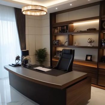 "A luxury curved executive desk featuring a dark walnut base, a grey desktop with a built-in black writing mat, and a matching black high-back leather chair."