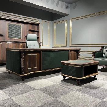 "A classic luxury executive desk and matching coffee table in dark walnut wood with emerald green quilted leather panels and gold trim."