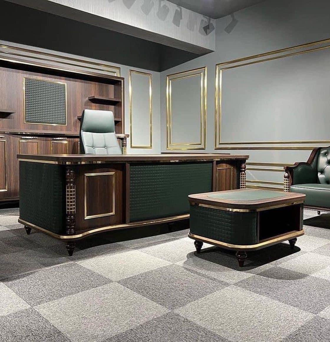 "A classic luxury executive desk and matching coffee table in dark walnut wood with emerald green quilted leather panels and gold trim."