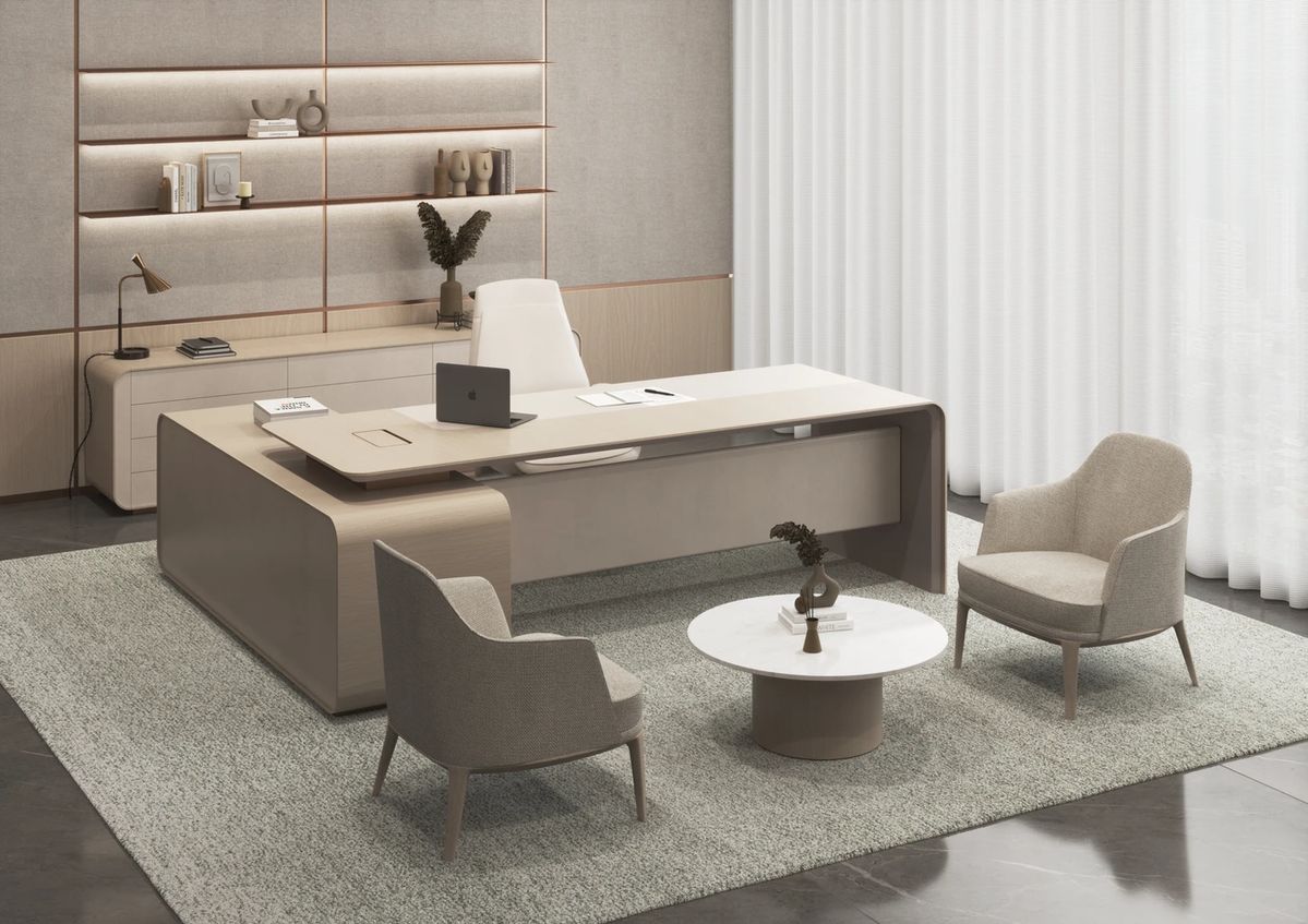 "A modern L-shaped executive desk in a soft taupe and beige finish, featuring smooth rounded edges, a floating desktop, and an integrated side return."