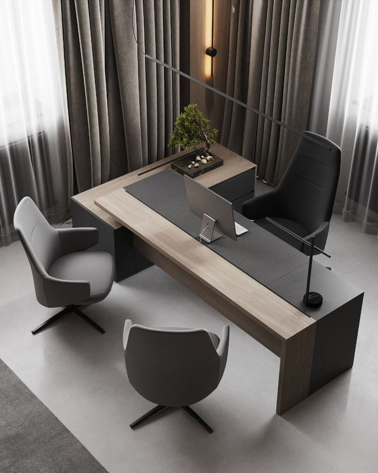 "An overhead view of a contemporary L-shaped executive desk featuring a two-tone top with a matte charcoal surface, a light wood grain accent border, and an integrated side credenza."