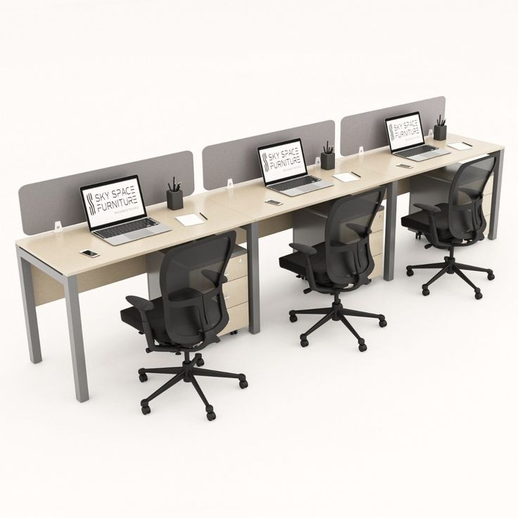 "A linear 3-person inline office workstation desk featuring light wood-grain tabletops, a silver-gray metal post-leg frame, rear-mounted gray privacy divider screens, and matching under-desk mobile filing cabinets."