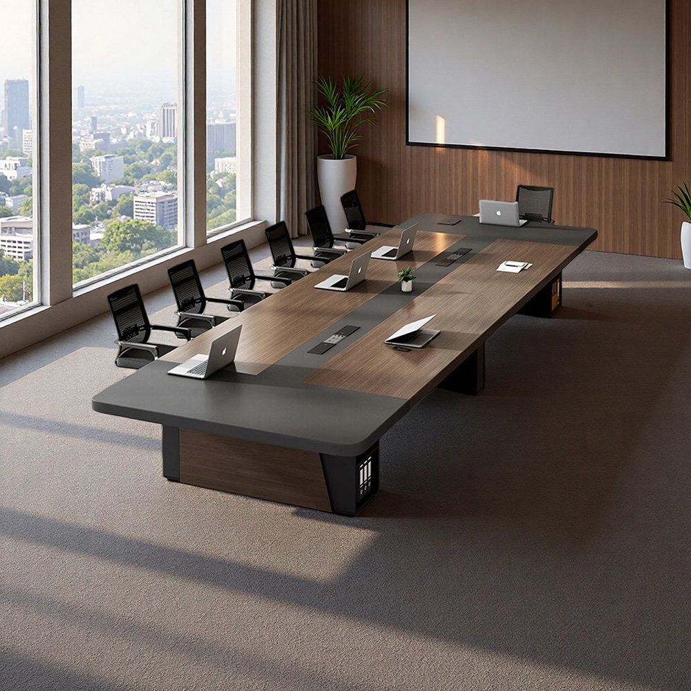 "A large, rectangular executive boardroom desk featuring a dark wood-grain top with a wrap-around matte grey border, a continuous black center media channel, and thick, matching wood and grey pedestal bases."