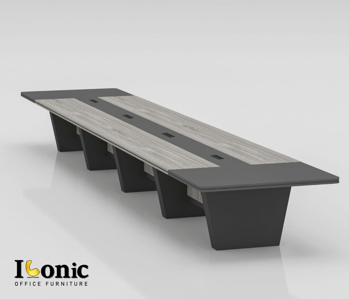 "An extra-large, multi-segment executive conference table featuring weathered gray wood-grain top panels flanked by charcoal dark gray end caps and a matching center media track, supported by a row of angled dark gray panel pedestal legs."