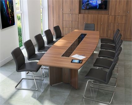 "A large, boat-shaped executive conference desk featuring a warm natural wood-grain top accented by a long, glossy black glass center media track, supported by integrated cross-shaped wood panel pedestal legs."