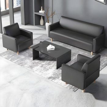 "A modern three-piece sofa set consisting of a sleek black matte three-seater couch and two matching single armchairs, all featuring plain cushions and light-colored wooden legs."